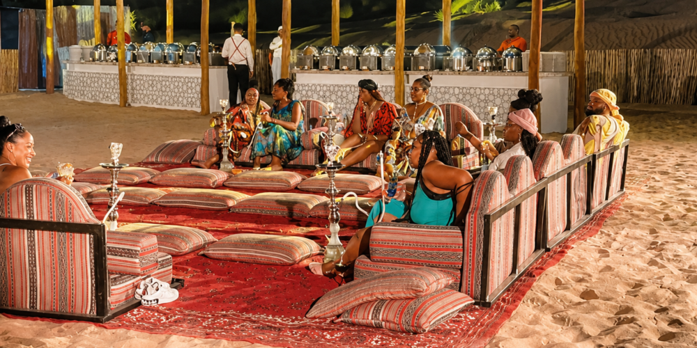 Guests gathered at a private evening reception under string lights