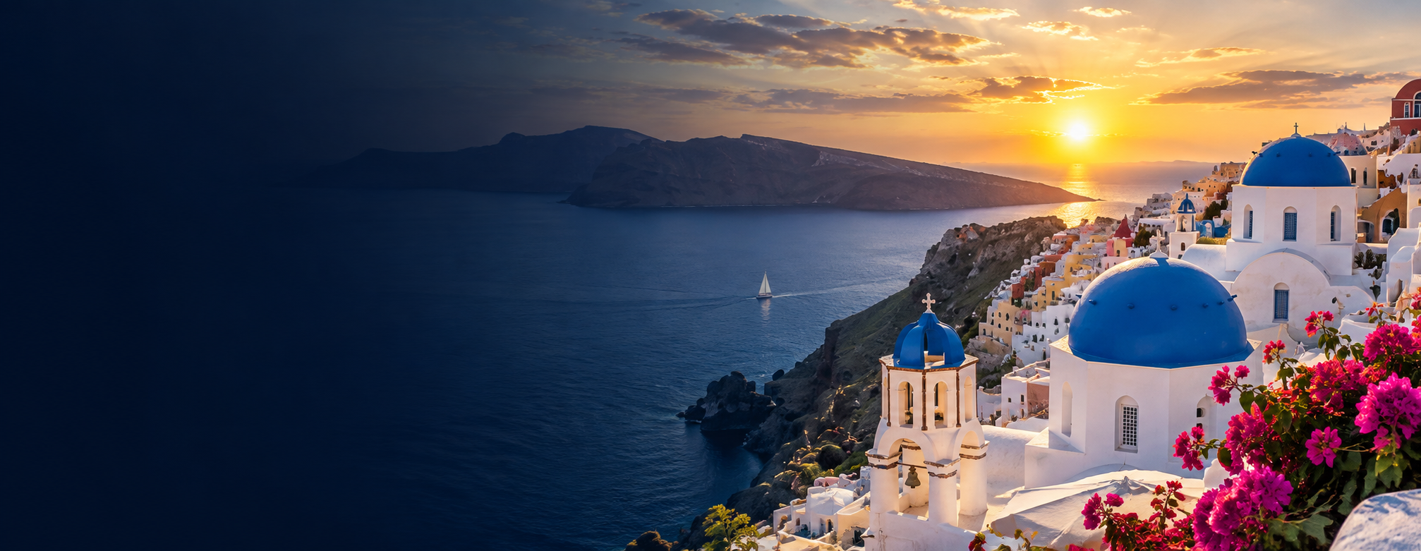 Whitewashed village and blue domed churches above the Aegean Sea at sunset in the Greek islands