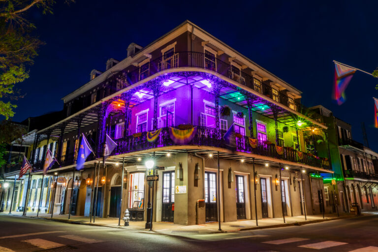 New Orleans riverboat lit up at dusk
